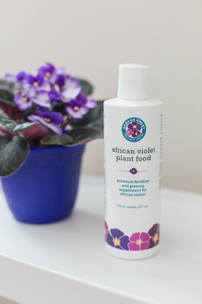 8 fl oz bottle of African violet plant food on a white background designed for use when African violet plants won’t bloom.